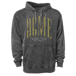 Photo of a stone washed gray hoodie. There is a large yellow screen print reading "BCME" across the chest. There is white screen printing below reading Become Nation barbell club EST MMXV